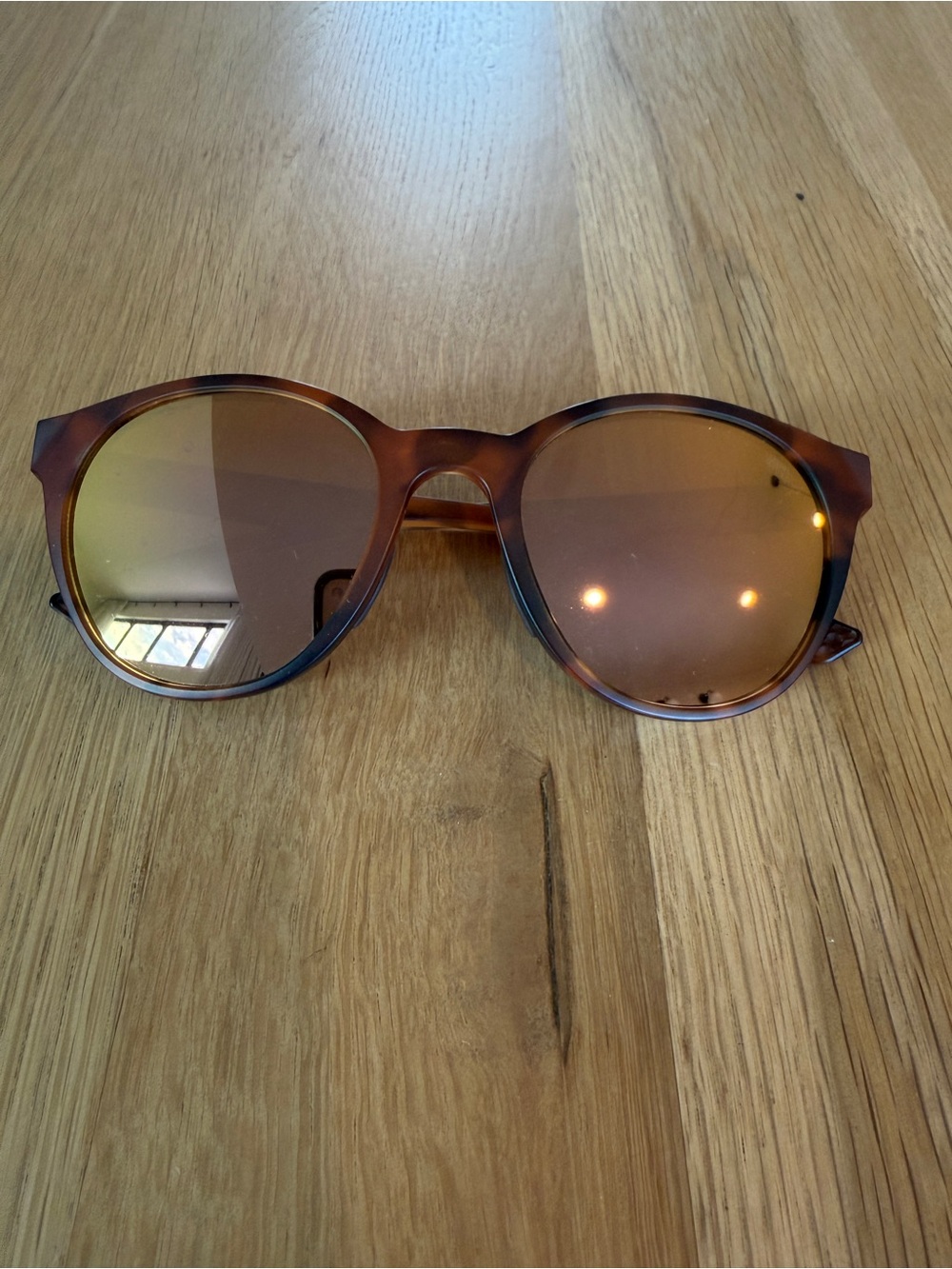 Oakley Tortoiseshell Round Sunglasses with Brown Mirrored Lenses